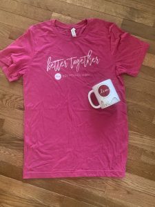 pink shirt and coffee mug Des Moines Mom
