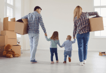 family with moving boxes. Tips for moving. Des Moines Mom