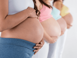 women holding pregnant belly