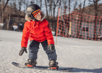 kid on snowboard. Family activities for winter olympics. Des Moines Mom