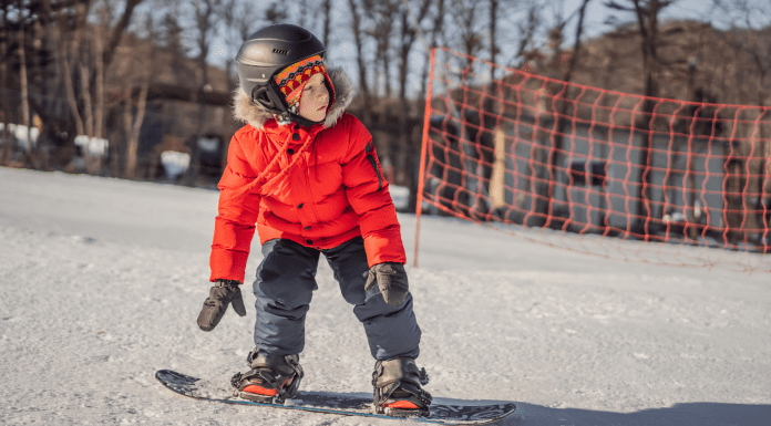 kid on snowboard. Family activities for winter olympics. Des Moines Mom