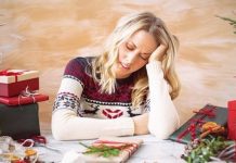 woman looking overwhelmed with holidays. Des Moines Mom