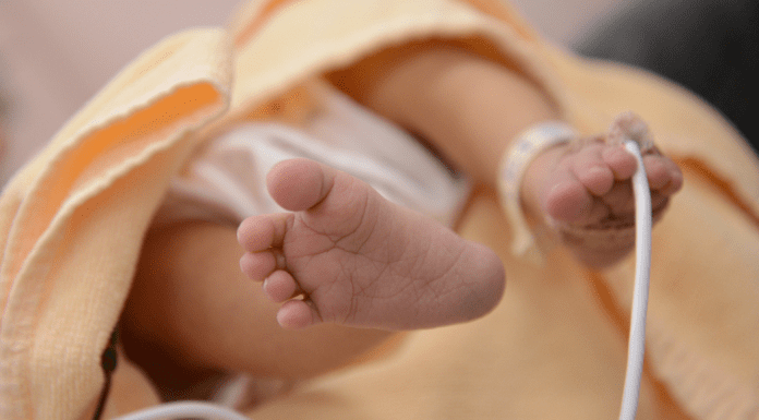 newborn baby toes with heart monitor NICU awareness